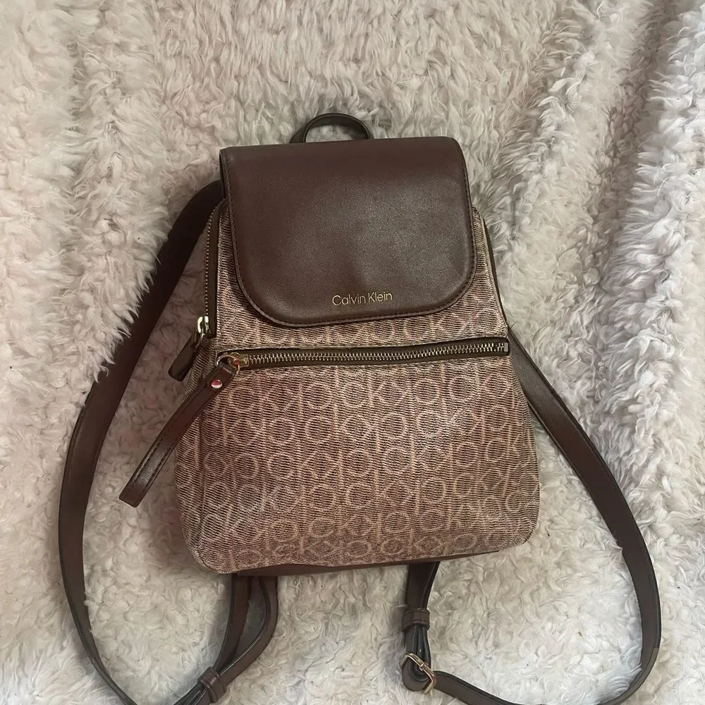 Calvin Klein Tan and Brown Logos  small Backpack logo tone hardwares.